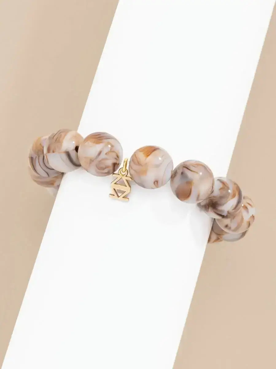 Stretch bracelet made of 15mm marbled resin beads.


-Open


-Pure Raw Materials


-Hand-Painted


-10mm Bead


-2.5" Diameter


-Nickel and Lead Compliant (Hypoallergenic)